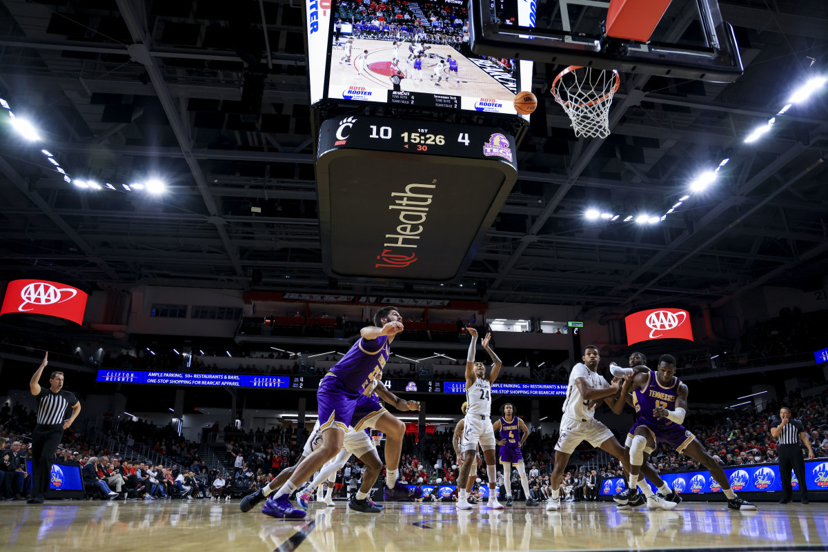 Dec 21, 2021; Cincinnati, Ohio, USA; Cincinnati Bearcats guard Jeremiah Davenport (24) attempts a free throw against the Tennessee Tech Golden Eagles in the first half at Fifth Third Arena. Mandatory Credit: Aaron Doster-USA TODAY Sports