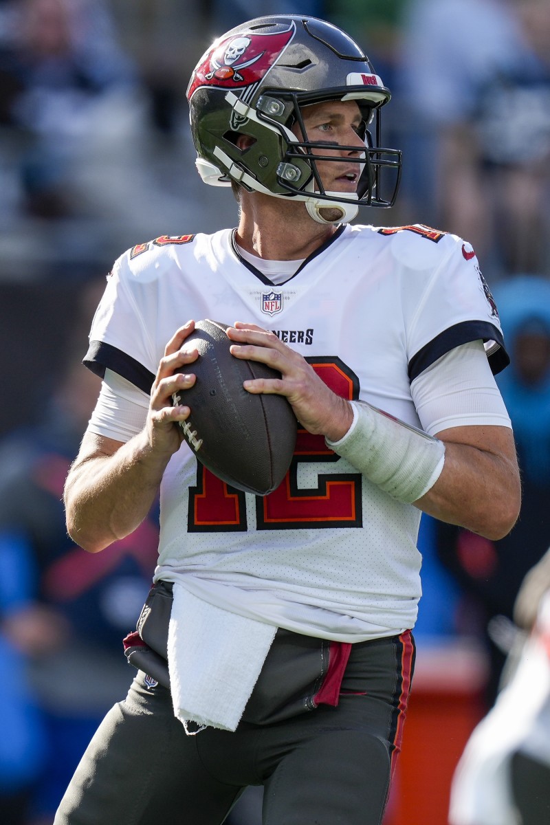 Dec 26, 2021; Charlotte, North Carolina, USA; Tampa Bay Buccaneers quarterback Tom Brady (12) back to pass against the Carolina Panthers during the second quarter at Bank of America Stadium. Mandatory Credit: Jim Dedmon-USA TODAY Sports