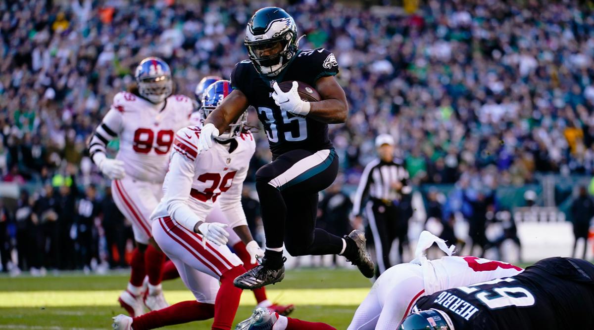 Philadelphia Eagles' Boston Scott scores a touchdown during the second half of an NFL football game against the New York Giants, Sunday, Dec. 26, 2021, in Philadelphia.