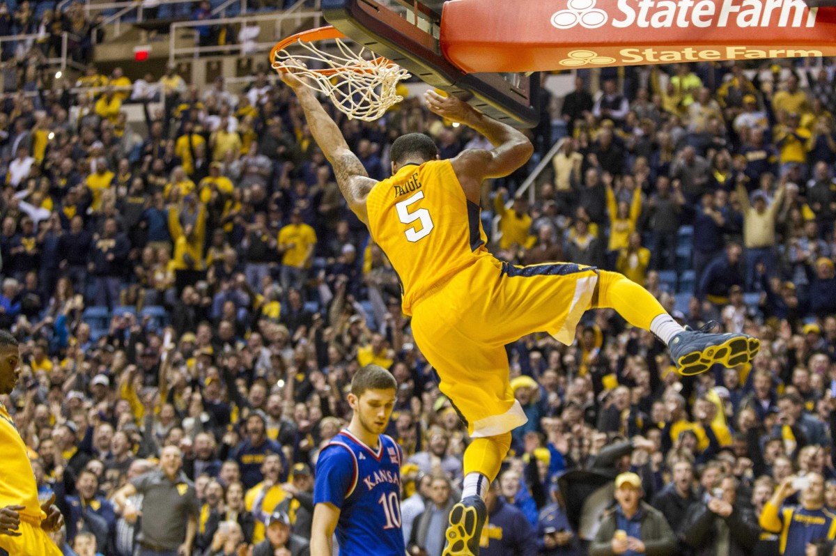 Jan 12, 2016; Morgantown, WV, USA; West Virginia Mountaineers guard Jaysean Paige (5) dunks the ball at the end of regulation to beat the Kansas Jayhawks at the WVU Coliseum.