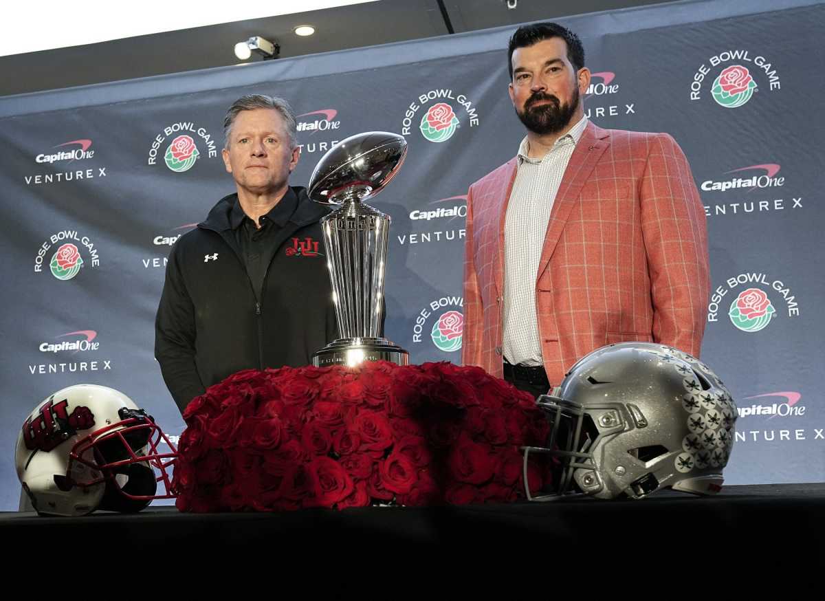Ohio State Buckeyes head coach Ryan Day and Utah Utes head coach Kyle Whittingham stand with the Rose Bowl trophy during a press conference in Los Angeles on Dec. 31, 2021. College Football Rose Bowl Coaches