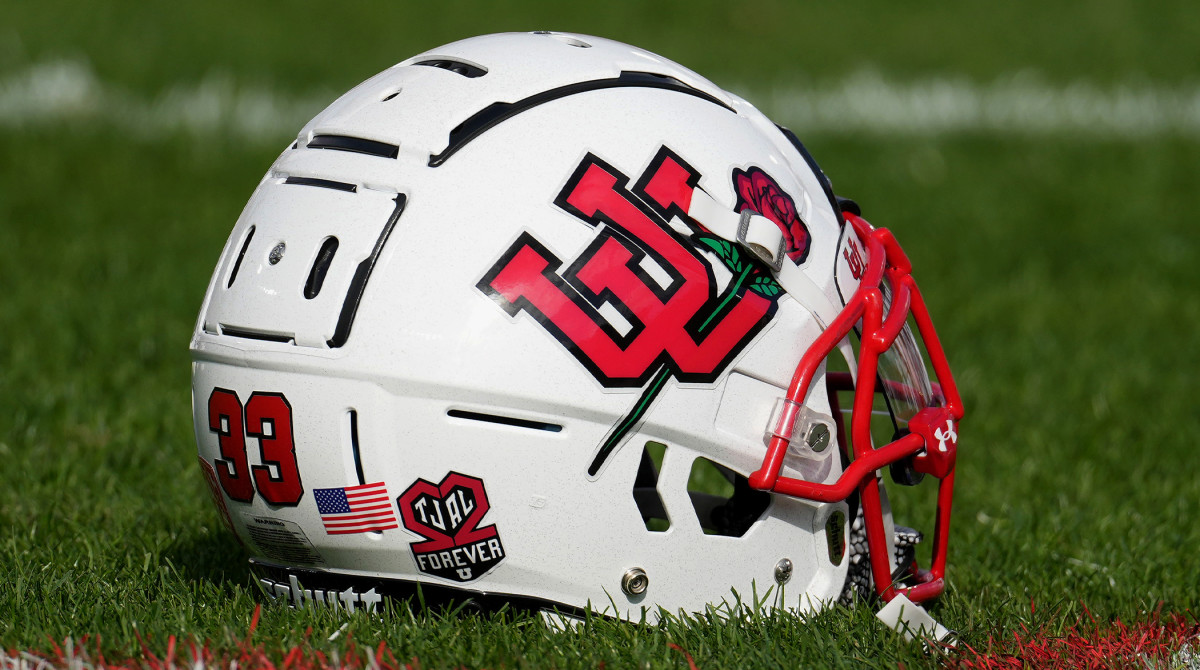 Jan 1, 2022; Pasadena, CA, USA; A Utah Utes football helmet sits on the field with a sticker honoring players Ty Jordan and Aaron Lowe before the 2022 Rose Bowl college football game against the Ohio State Buckeyes at the Rose Bowl.