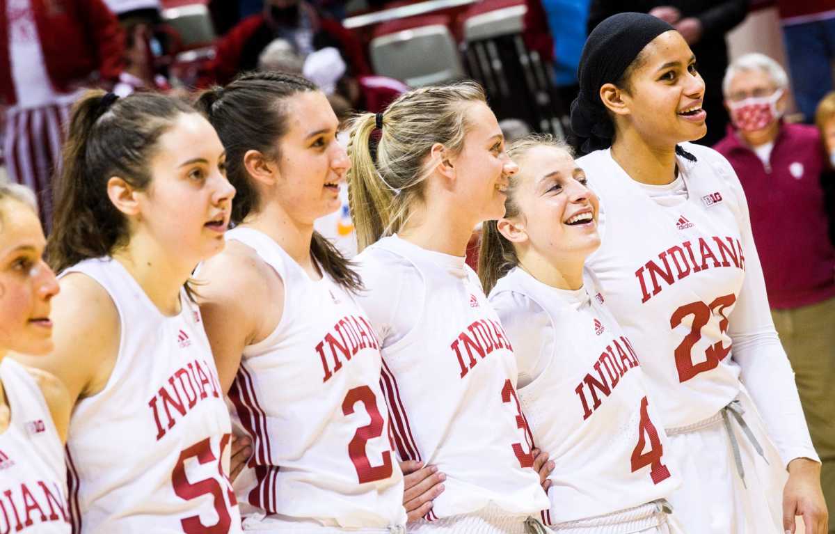 The Indiana women's basketball team listens to the National Anthem at Simon Skjodt Assembly Hall.