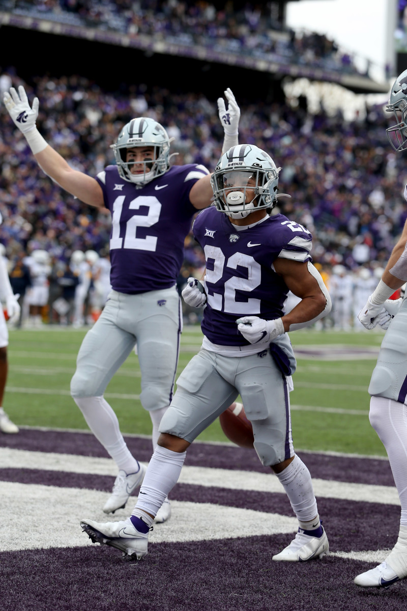 Nov 13, 2021; Manhattan, Kansas, USA; Kansas State Wildcats running back Deuce Vaughn (22) and wide receiver Landry Weber (12) celebrate a touchdown by Vaughn in the fourth quarter against the West Virginia Mountaineers at Bill Snyder Family Football Stadium.
