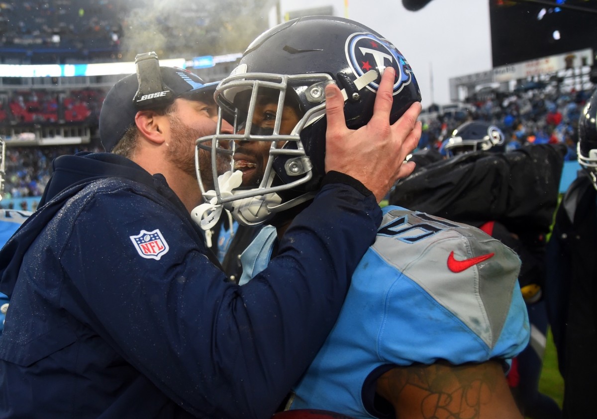 Tennessee Titans outside linebacker David Long (51) celebrates with defensive coordinator Shane Bowen after an interception during the second half against the Miami Dolphins at Nissan Stadium.