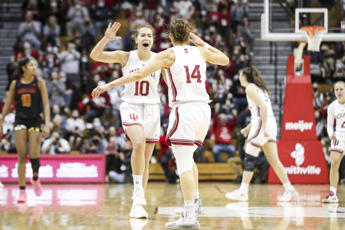 Aleksa Gulbe and Ali Patberg high five during the Indiana vs. Maryland game at home.