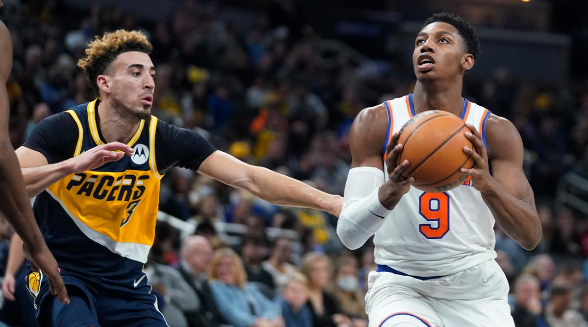 New York Knicks' RJ Barrett (9) is defended by Indiana Pacers' Chris Duarte (3) during the first half of an NBA basketball game Wednesday, Dec. 8, 2021, in Indianapolis.
