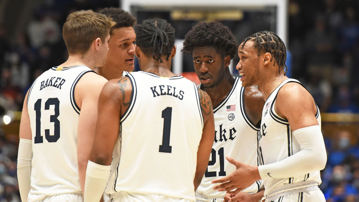 Duke men's basketball huddles during a game