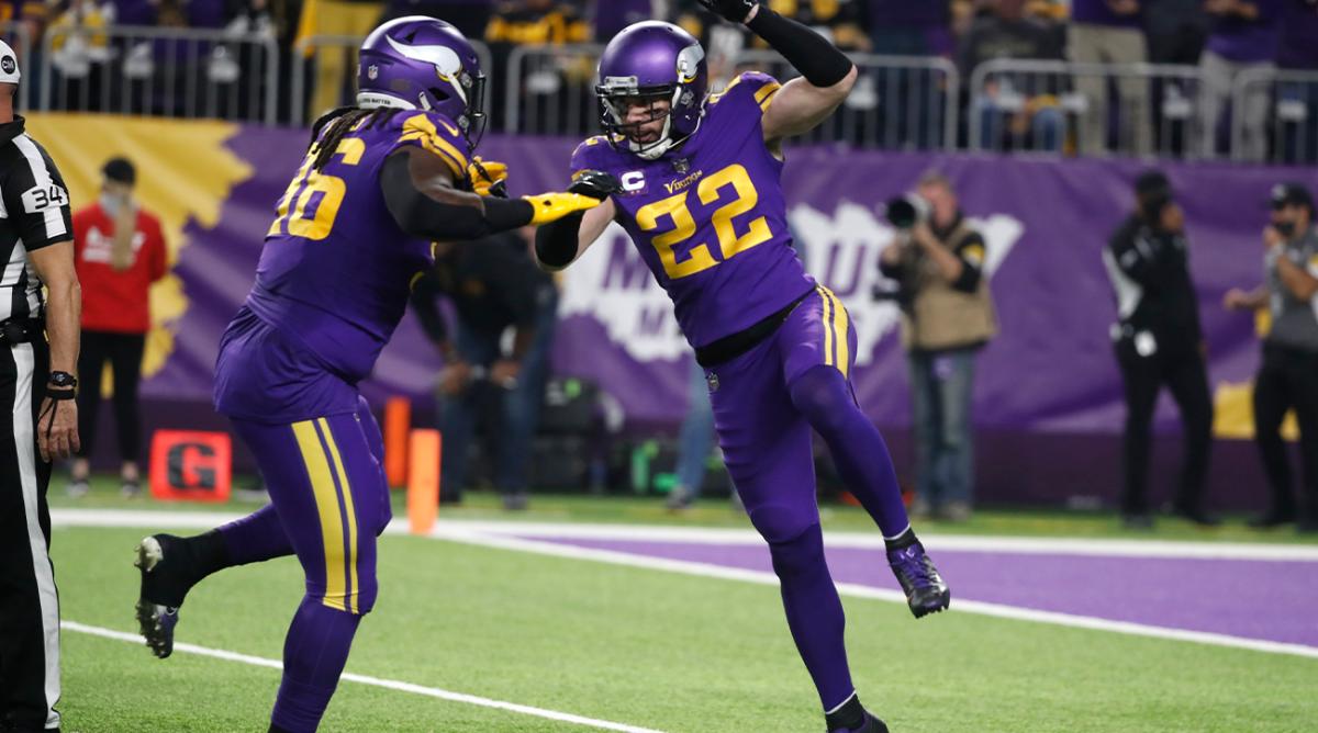 Minnesota Vikings safety Harrison Smith (22) celebrates with teammate defensive tackle Armon Watts (96) after sacking Pittsburgh Steelers quarterback Ben Roethlisberger during the first half of an NFL football game, Thursday, Dec. 9, 2021, in Minneapolis.