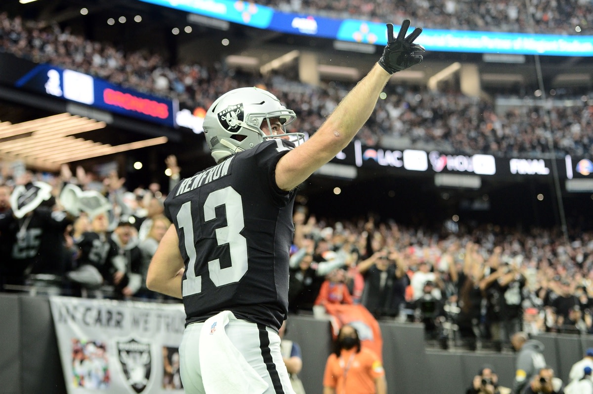 Dec 26, 2021; Paradise, Nevada, USA; Las Vegas Raiders wide receiver Hunter Renfrow (13) celebrates his touchdown catch during the first half at Allegiant Stadium. Mandatory Credit: Joe Camporeale-USA TODAY Sports