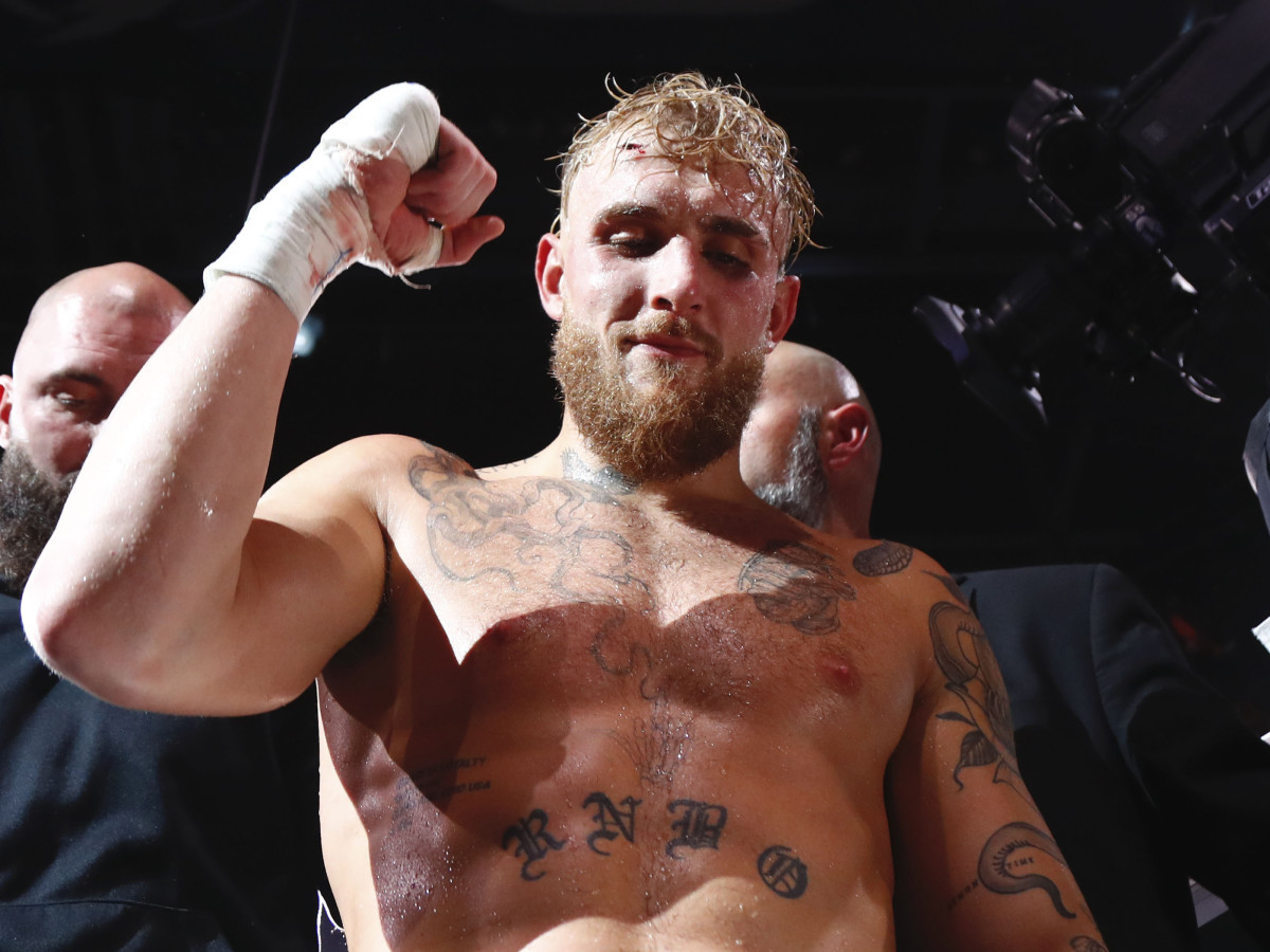 Jake Paul celebrates after knocking out Tyron Woodley (not pictured) at Amalie Arena.