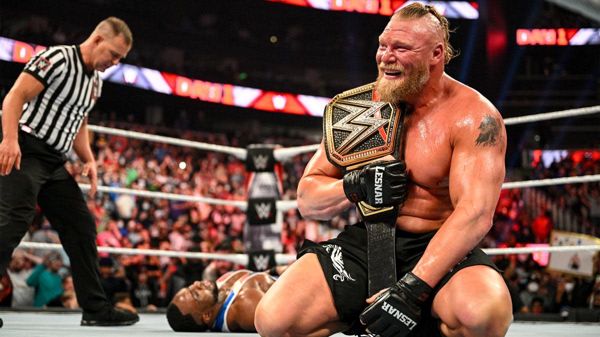 Brock Lesnar celebrates after winning WWE championship
