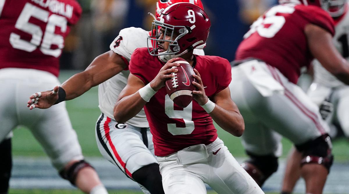 FILE - Alabama quarterback Bryce Young (9) works against Georgia during the second half of the Southeastern Conference championship NCAA college football game Dec. 4, 2021, in Atlanta. Alabama plays Georgia in the College Football Playoff national championship game on Jan. 10, 2022.