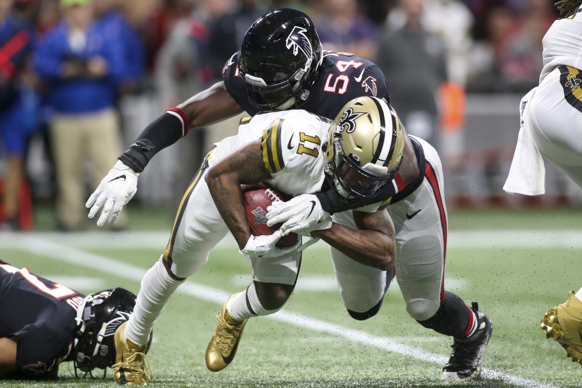 Atlanta Falcons linebacker Foye Oluokun (54) tackles New Orleans Saints wide receiver Deonte Harris (11). Mandatory Credit: Brett Davis-USA TODAY Sports