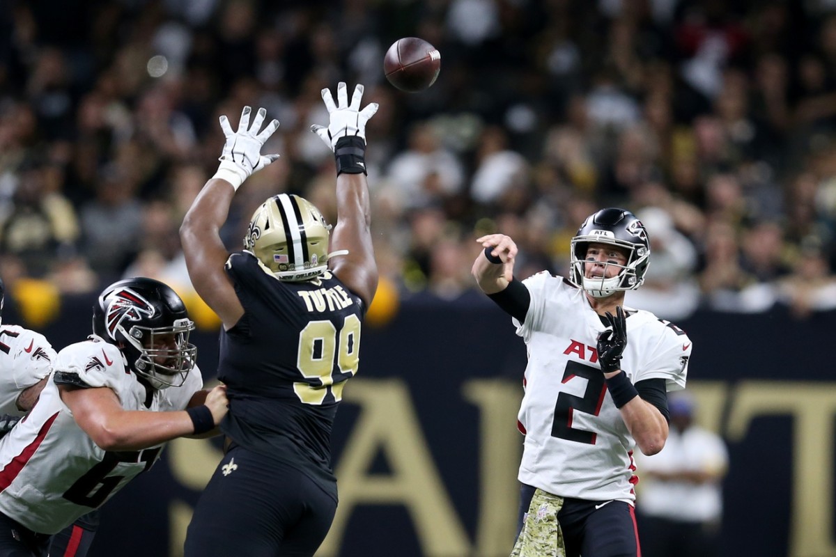 Atlanta Falcons quarterback Matt Ryan (2) throws a pass over New Orleans Saints defensive tackle Shy Tuttle (99). Mandatory Credit: Chuck Cook-USA TODAY Sports