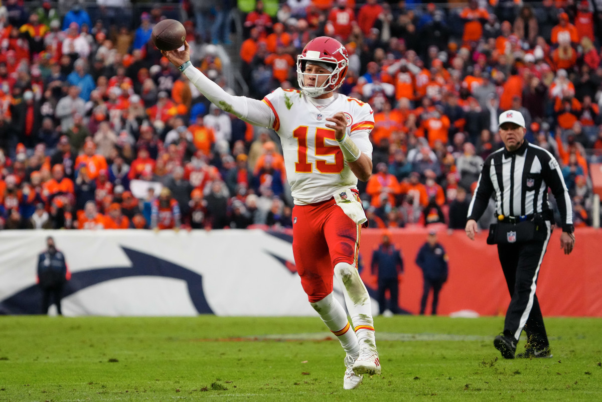 Jan 8, 2022; Denver, Colorado, USA; Kansas City Chiefs quarterback Patrick Mahomes (15) attempts a pass in the second quarter against the Denver Broncos at Empower Field at Mile High. Mandatory Credit: Ron Chenoy-USA TODAY Sports