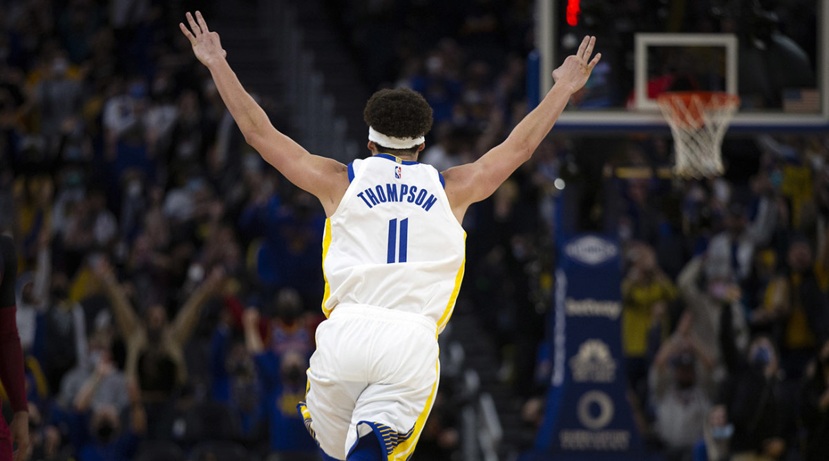 Golden State Warriors guard Klay Thompson (11) celebrates his 1800th career three-point basket
