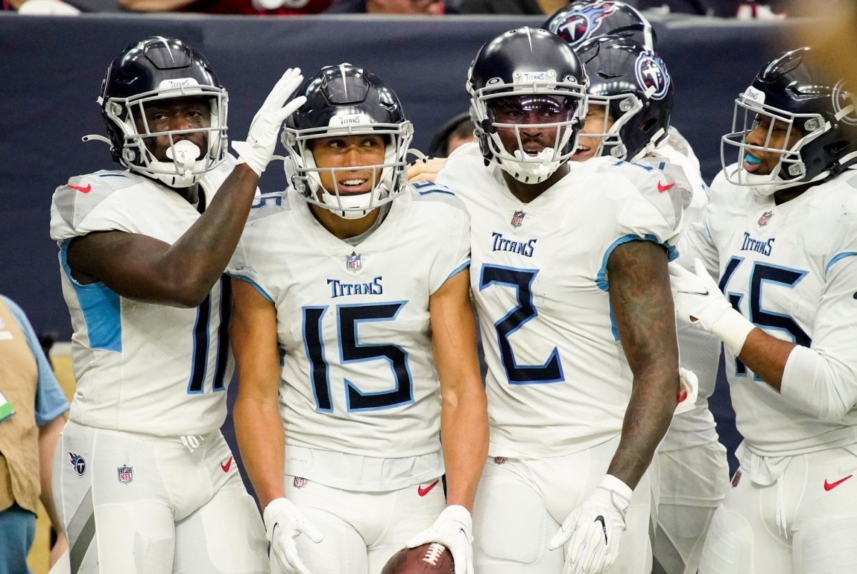 Tennessee Titans wide receiver Nick Westbrook-Ikhine (15) is congratulated on his touchdown during the second quarter at NRG Stadium Sunday, Jan. 9, 2022 in Houston, Texas.