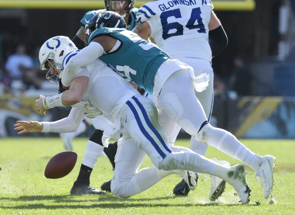 Jacksonville Jaguars middle linebacker Damien Wilson (54) forces a fumble during a sack on Indianapolis Colts quarterback Carson Wentz (2) which the Jaguars recovered during early third quarter action. The Jacksonville Jaguars hosted the Indianapolis Colts at TIAA Bank Field in Jacksonville, Florida for the Jaguars final game of the season Sunday, January 9, 2022. The Jaguars finished out their season with a 26 to 11 victory over the Colts. [Bob Self/Florida Times-Union] Jki 010922 Bsjaguarsvscolt 14