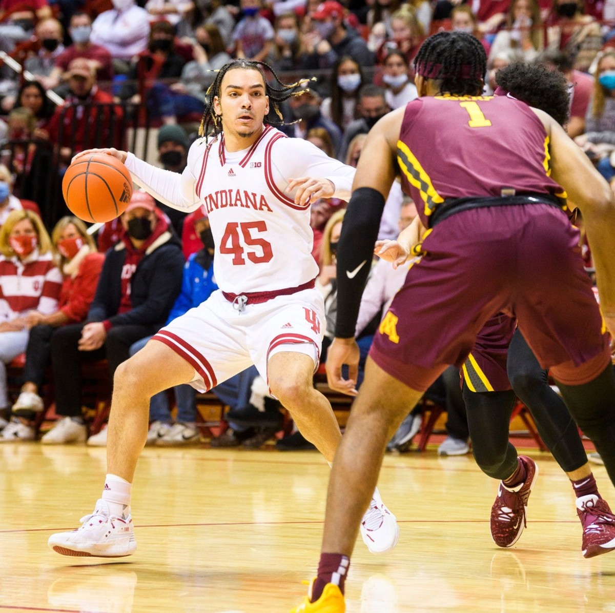 Indiana's Parker Stewart (45) looks for the open man against Minnesota. (Rich Janzaruk/USA TODAY Sports)