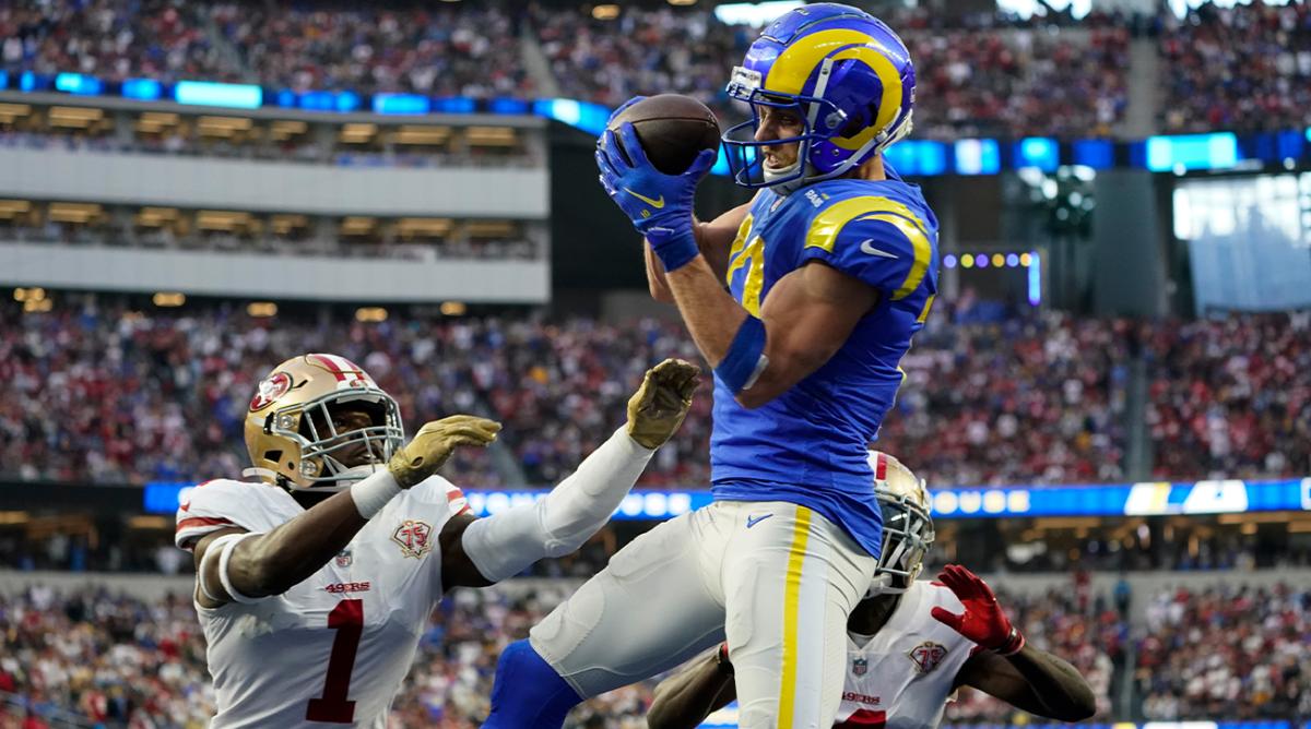 Los Angeles Rams wide receiver Cooper Kupp, center, catches a pass for a touchdown during the second half of an NFL football game against the San Francisco 49ers Sunday, Jan. 9, 2022, in Inglewood, Calif. 49ers free safety Jimmie Ward (1) and cornerback Emmanuel Moseley (4) defend.