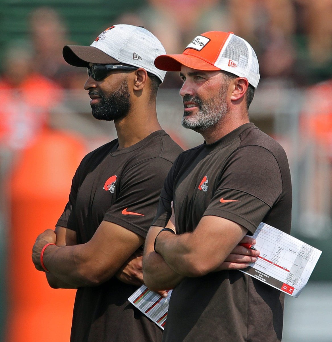 Cleveland Browns GM Andrew Berry, left, and head coach Kevin Stefanski watch the team practice during NFL football training camp, Saturday, July 31, 2021, in Berea, Ohio. Brownscamp31 5