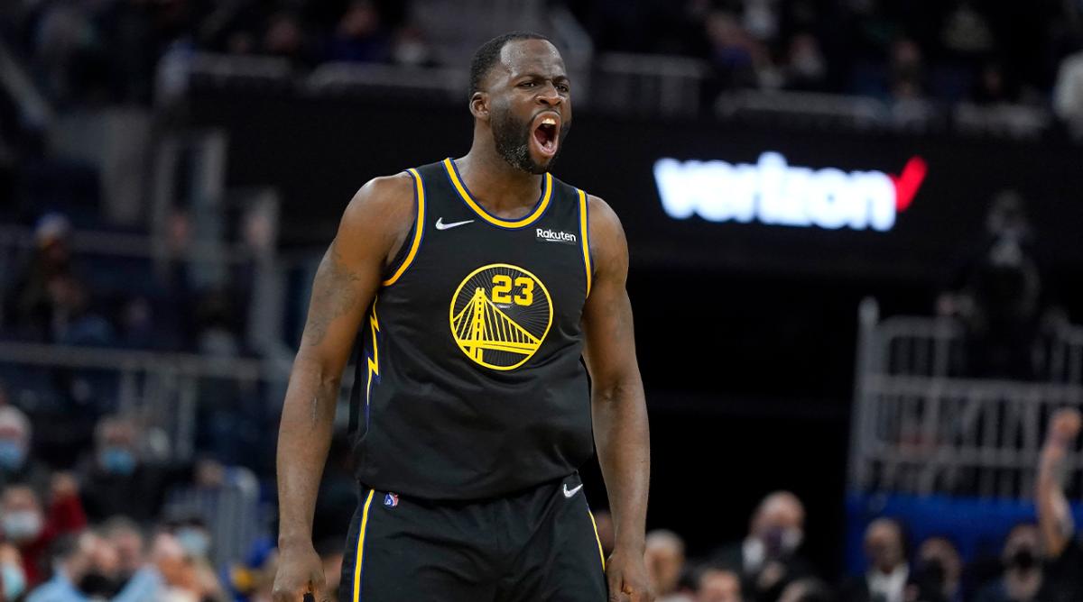 Golden State Warriors forward Draymond Green (23) reacts toward the Miami Heat bench after shooting a 3-point basket during the second half of an NBA basketball game in San Francisco, Monday, Jan. 3, 2022.