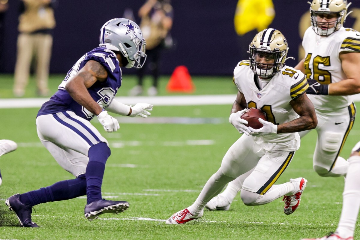 New Orleans Saints wide receiver Deonte Harris (11) runs past Dallas Cowboys cornerback Anthony Brown (30). Mandatory Credit: Stephen Lew-USA TODAY Sports