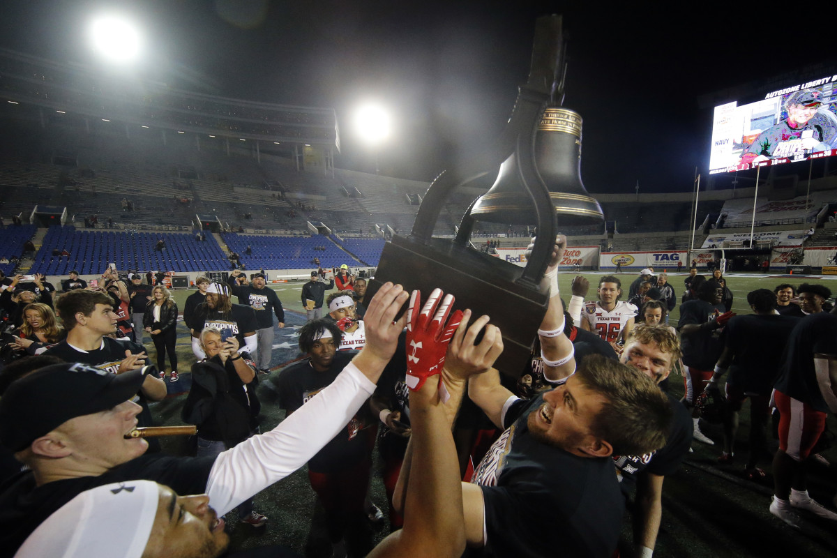 Texas Tech players and staff celebrate a lopsided Liberty Bowl win over Mississippi State.