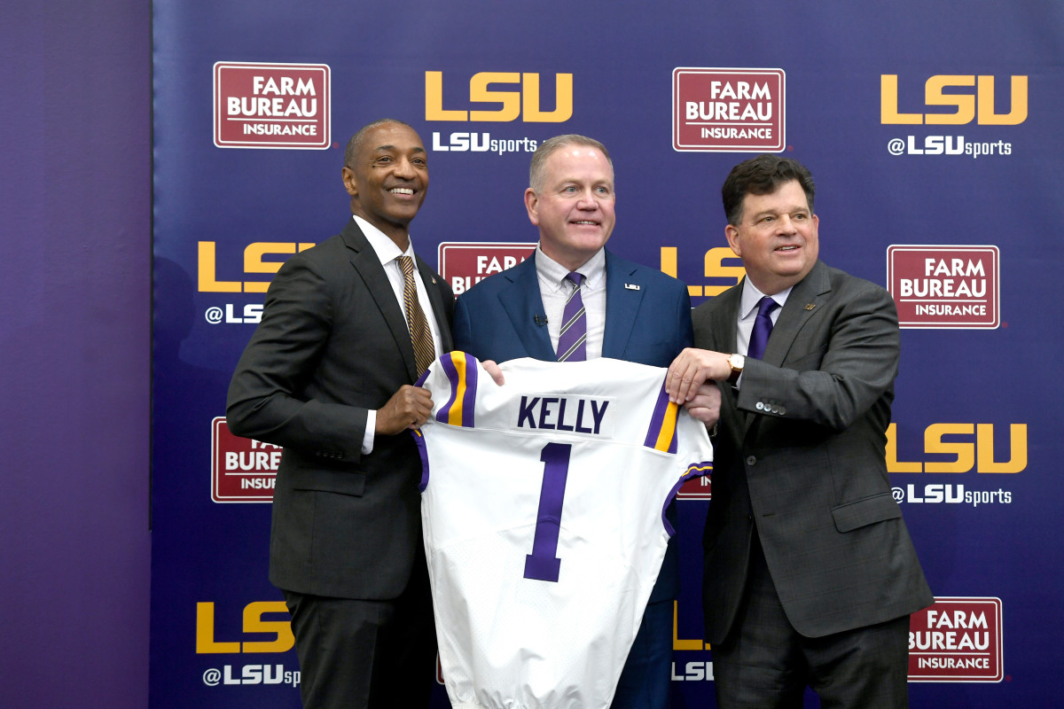 Brian Kelly poses after being introduced as LSU's next head coach.