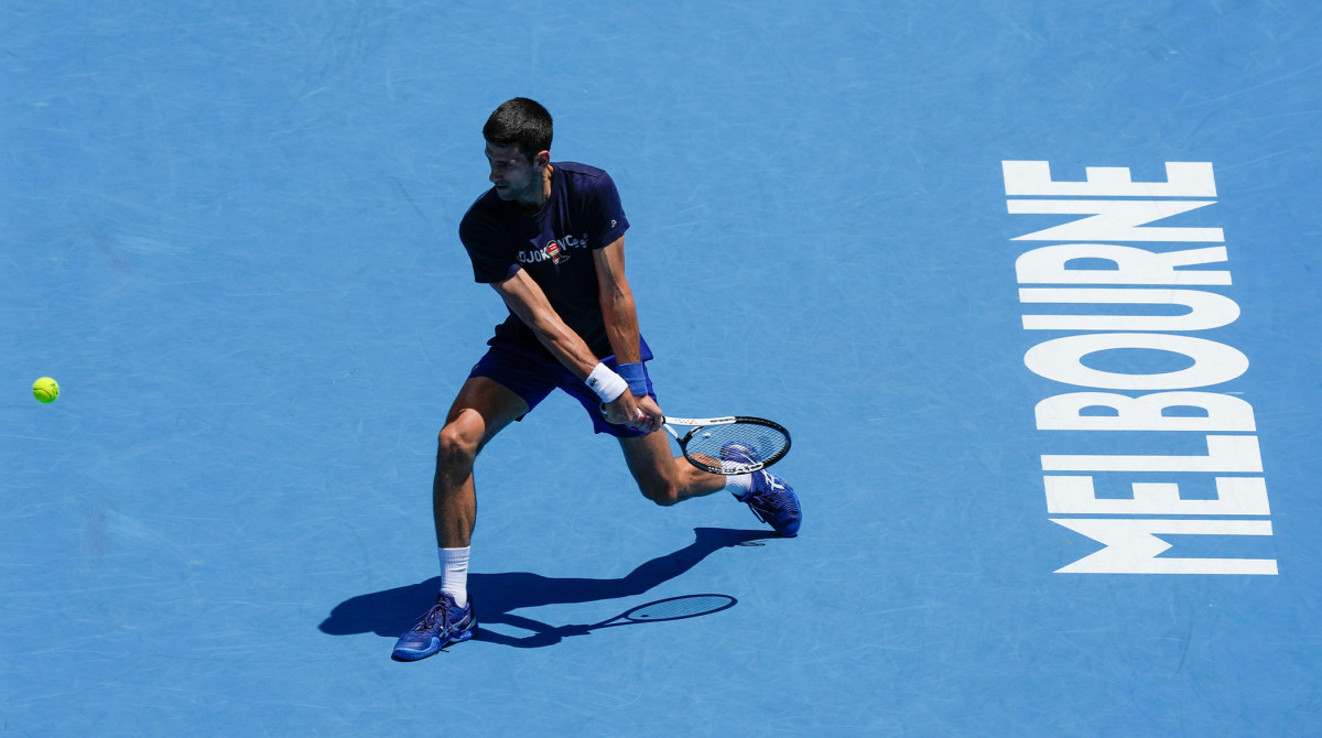 Defending men's champion Serbia's Novak Djokovic practices on Rod Laver Arena ahead of the Australian Open tennis championship in Melbourne, Australia, Wednesday, Jan. 12, 2022.