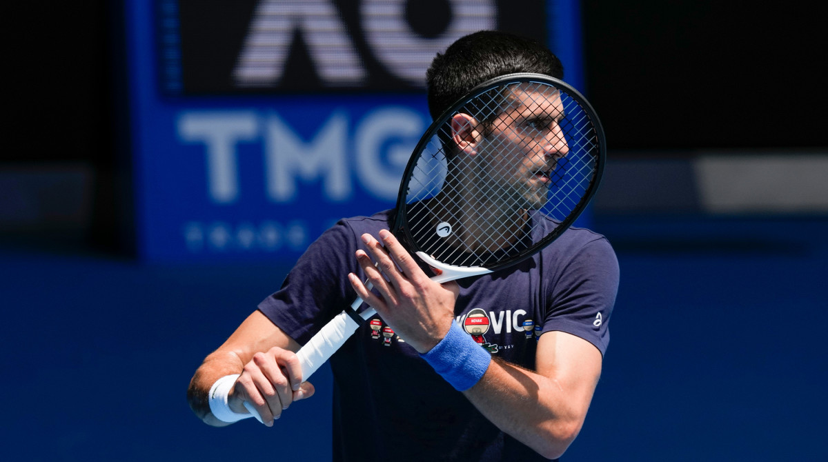 Defending men's champion Serbia's Novak Djokovic practices on Rod Laver Arena ahead of the Australian Open tennis championship in Melbourne, Australia, Wednesday, Jan. 12, 2022.