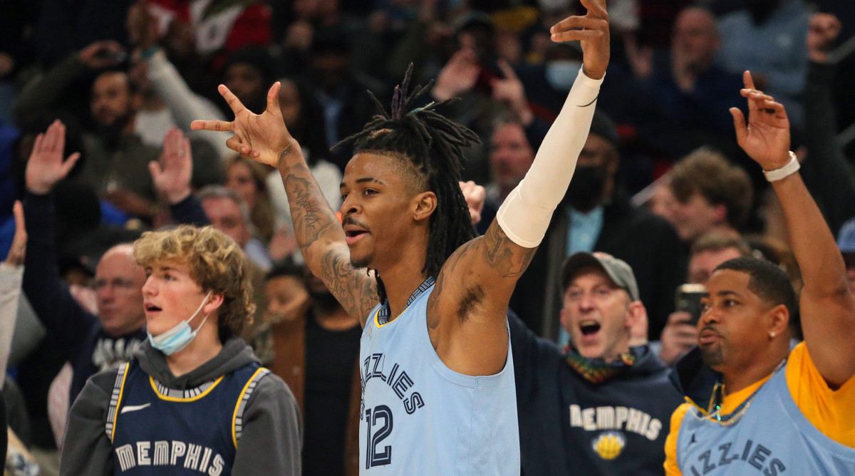 Memphis Grizzles guard Ja Morant (12) reacts after a basket during the second half against the Golden State Warriors at FedExForum.
