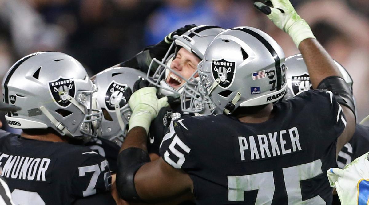 Las Vegas Raiders kicker Daniel Carlson, center, celebrates after kicking the game-winning field goal against the Los Angeles Chargers during overtime of an NFL football game, Sunday, Jan. 9, 2022, in Las Vegas.
