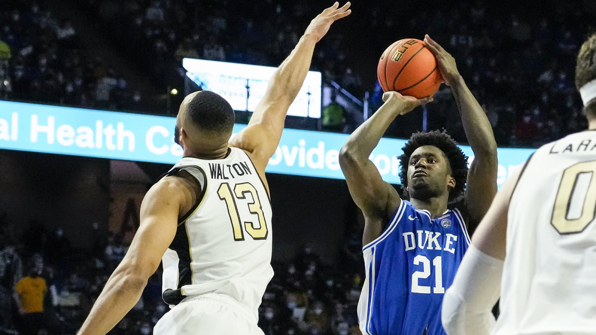 Duke Blue Devils forward A.J. Griffin (21) shoots over Wake Forest Demon Deacons forward Dallas Walton.