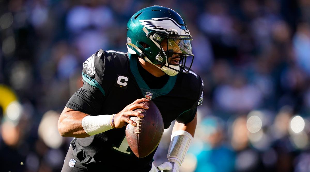 Philadelphia Eagles' Jalen Hurts runs during the first half of an NFL football game against the New York Giants, Sunday, Dec. 26, 2021, in Philadelphia.