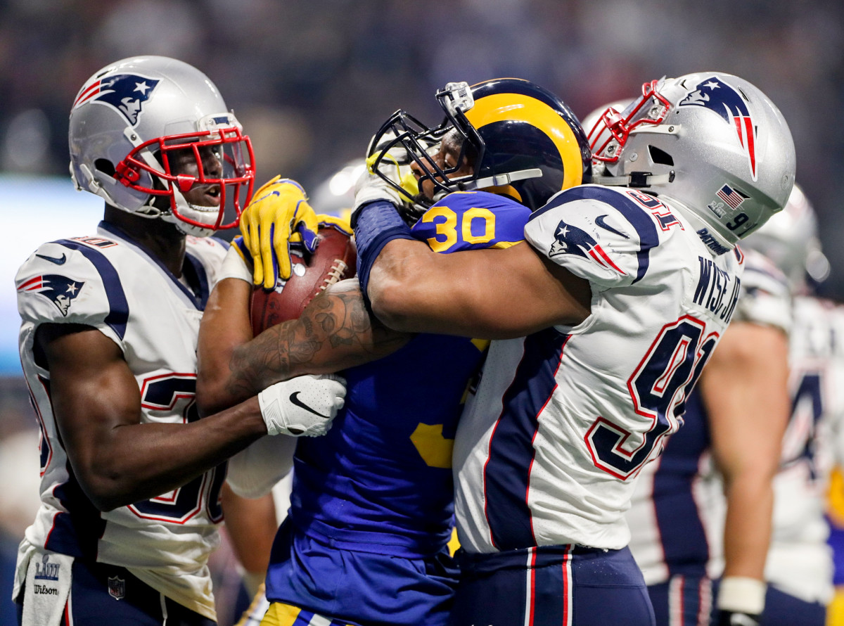 The Patriots gang-tackle Todd Gurley during Super Bowl LIII