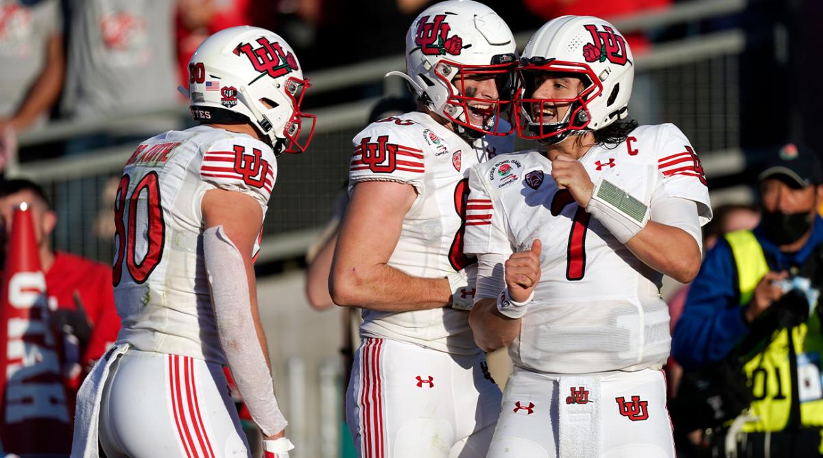 Utah quarterback Cameron Rising (7) celebrates his touchdown run with teammates during the first half in the Rose Bowl NCAA college football game against Ohio State Saturday, Jan. 1, 2022, in Pasadena, Calif.