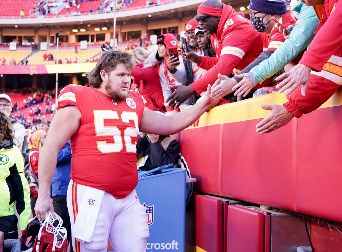 Dec 12, 2021; Kansas City, Missouri, USA; Kansas City Chiefs center Creed Humphrey (52) greets fans while leaving the field after the win over the Las Vegas Raiders at GEHA Field at Arrowhead Stadium. Mandatory Credit: Denny Medley-USA TODAY Sports