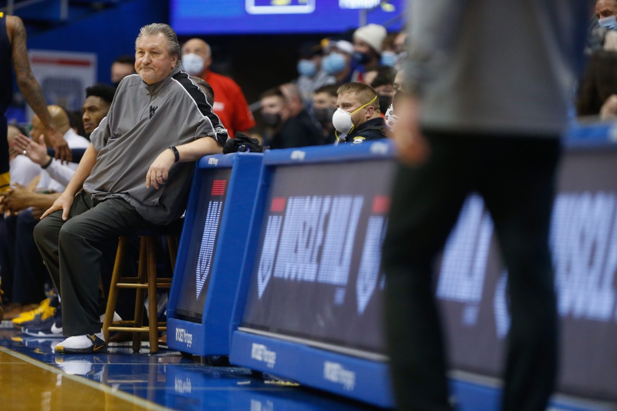 West Virginia coach Bob Huggins watches is team fall to Kansas from his bench during the second half of Saturday's game inside Allen Fieldhouse.