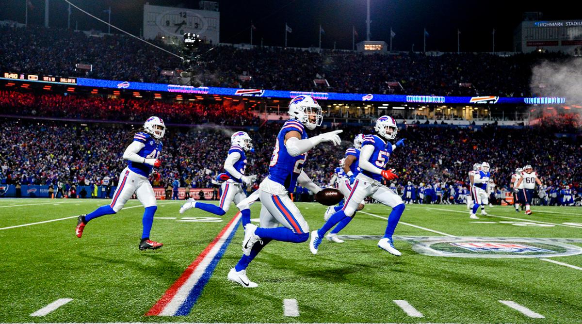 Buffalo Bills safety Micah Hyde, center, celebrates after catching an interception during the first half of an NFL wild-card playoff football game against the New England Patriots, Saturday, Jan. 15, 2022, in Orchard Park, N.Y.