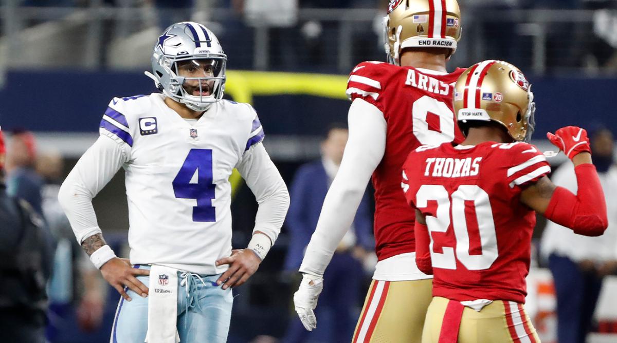 Dallas Cowboys quarterback Dak Prescott (4) reacts next to San Francisco 49ers defensive end Arik Armstead, middle, and cornerback Ambry Thomas (20) after the final play of an NFL wild-card playoff football game in Arlington, Texas, Sunday, Jan. 16, 2022.