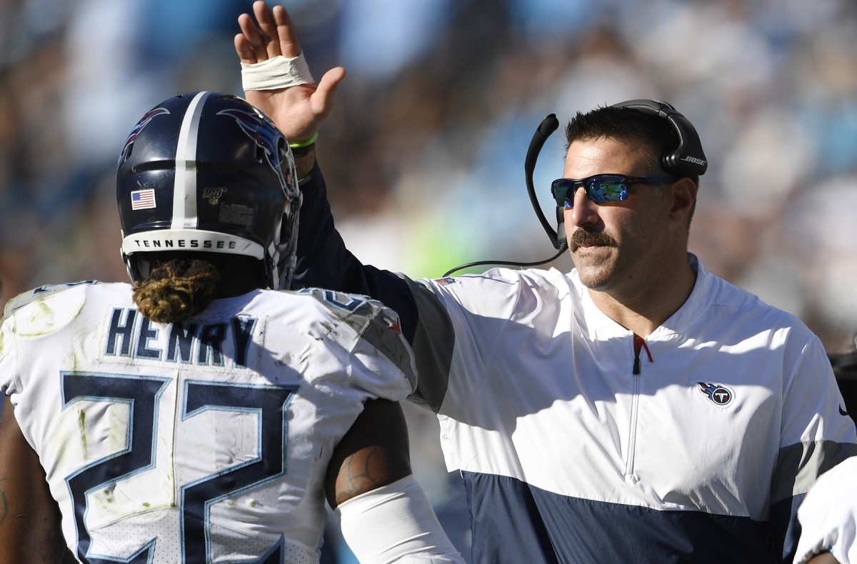 Tennessee Titans head coach Mike Vrabel, center, congratulates running back Derrick Henry (22) after his touchdown during the third quarter against the Carolina Panthers at Bank of America Stadium Nov. 3, 2019 in Charlotte, N.C.