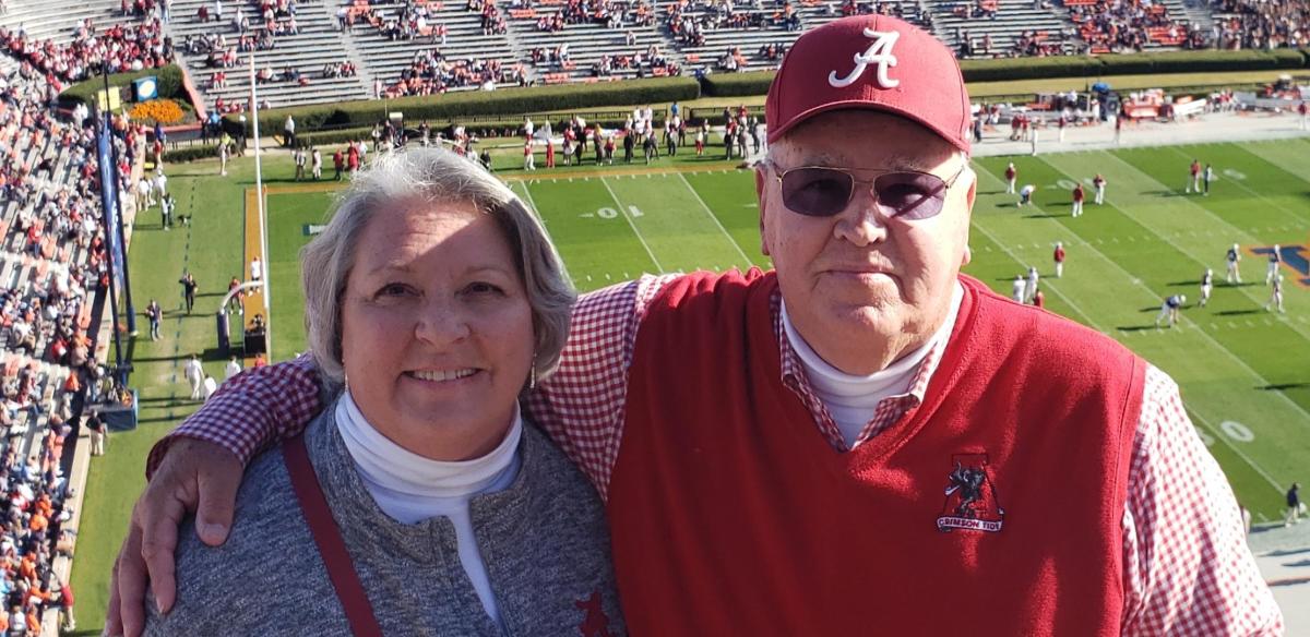 Tommy Ray and his wife Sarah attend the Alabama-Auburn football game in 2021. Tommy has attended every Crimson Tide game since 1972.
