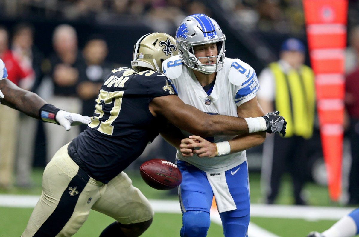 Oct 15, 2017; Detroit Lions quarterback Matthew Stafford (9) fumbles after being hit by New Orleans Saints defensive end Alex Okafor (57). Mandatory Credit: Chuck Cook-USA TODAY Sports