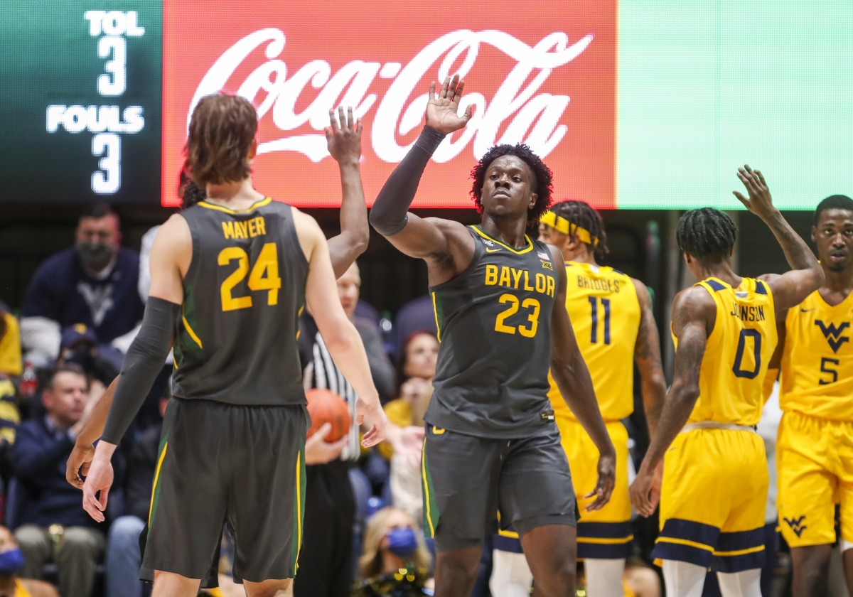 Jan 18, 2022; Morgantown, West Virginia, USA; Baylor Bears forward Jonathan Tchamwa Tchatchoua (23) celebrates with teammates after a play during the second half against the West Virginia Mountaineers at WVU Coliseum.