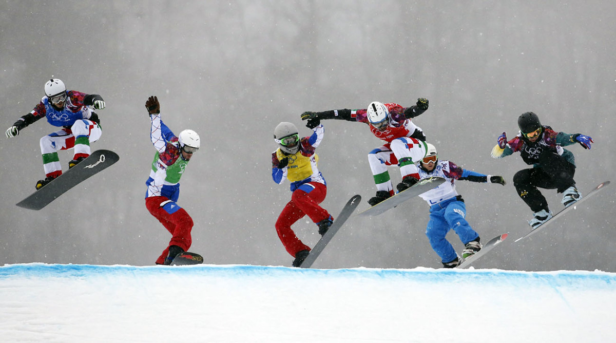 Pierre Vaultier races against competitors during the second heat of the semifinals in men's snowboard cross during the Sochi 2014 Olympic Winter Games at Rosa Khutor Extreme Park.