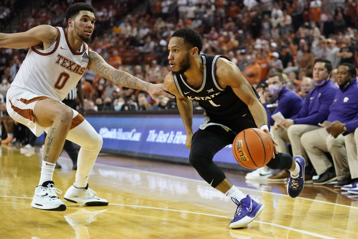 Jan 18, 2022; Austin, Texas, USA; Kansas State Wildcats guard Markquis Nowell (1) drives to the basket while defended by Texas Longhorns forward Timmy Allen (0) during the second half at Frank C. Erwin Jr. Center.