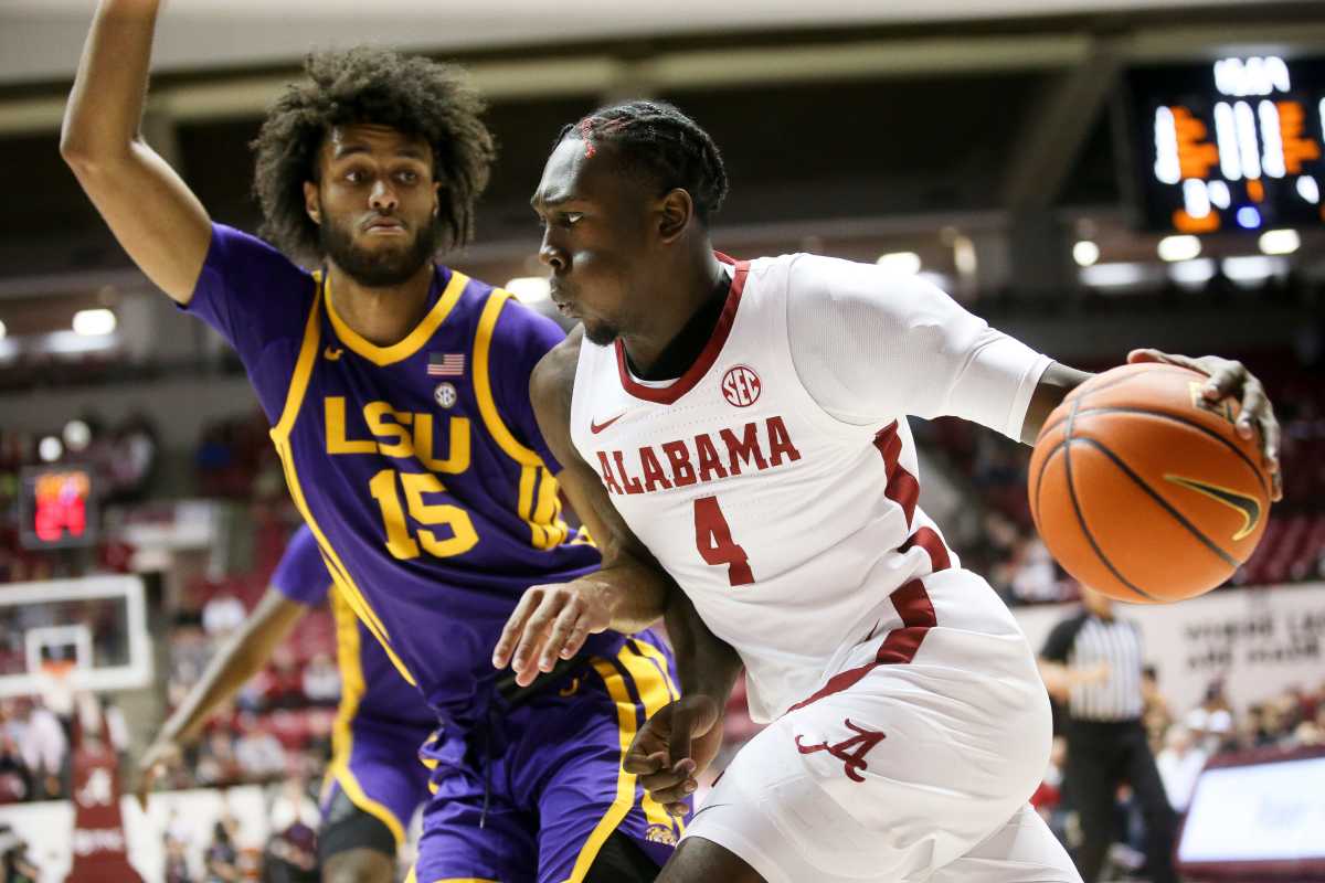 Alabama forward Juwan Gary (4) drives along the baseline against LSU center Efton Reid (15) in Coleman Coliseum on the campus of the University of Alabama.