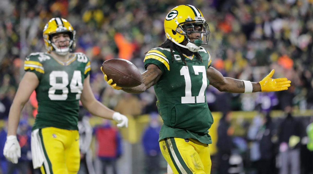 Green Bay Packers' Davante Adams reacts after catchiong a touchdown pass during the first half of an NFL football game against the Minnesota Vikings Sunday, Jan. 2, 2022, in Green Bay, Wis.